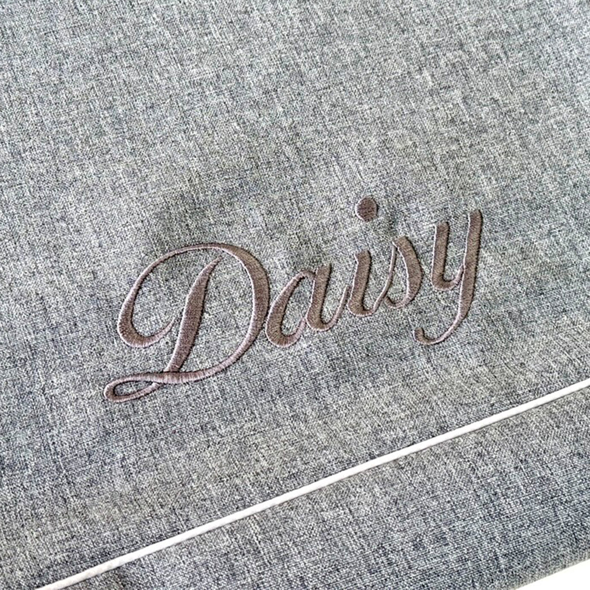 Custom embroidered dog name on an ANBERSO bed cover