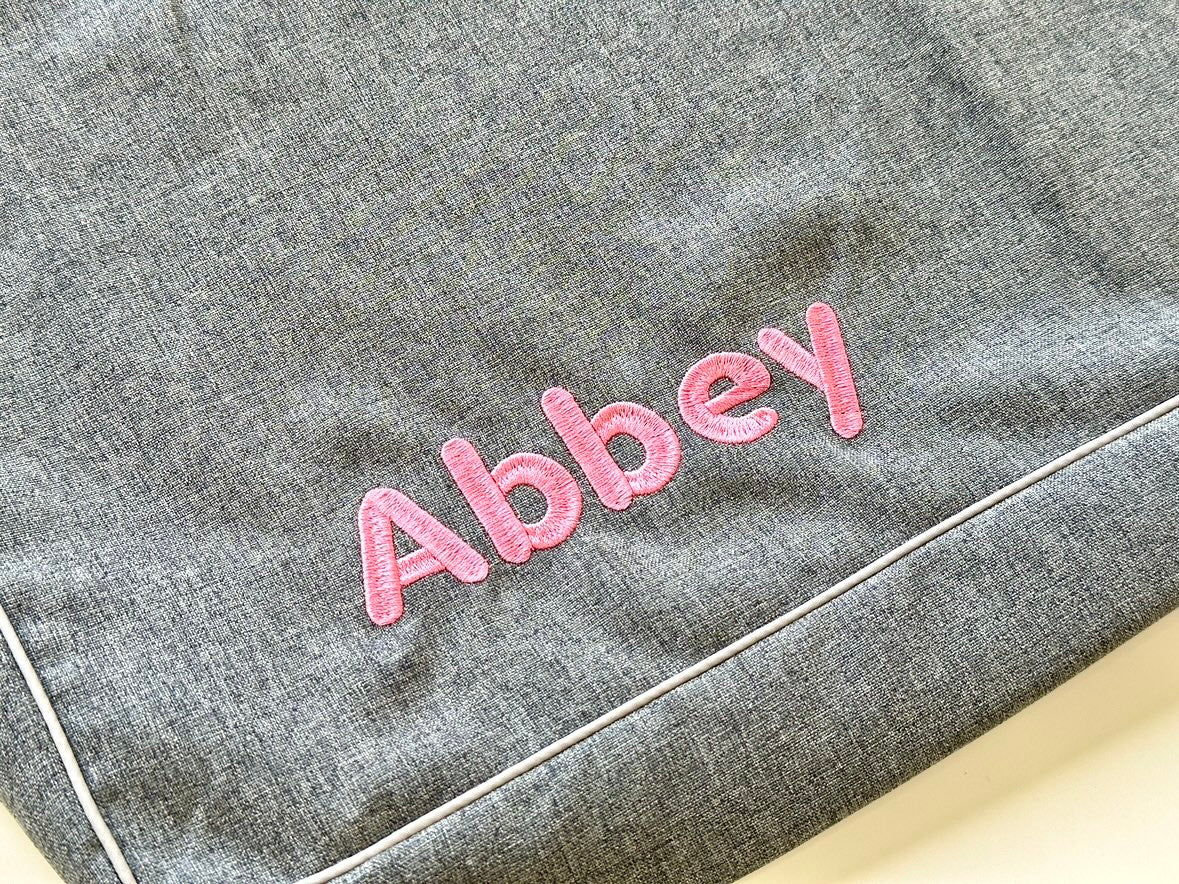 Optional pink name embroidery example on Cammy Irish Gray cover